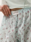 Miętowe letnie lekkie spodnie z falbankami w kwiaty